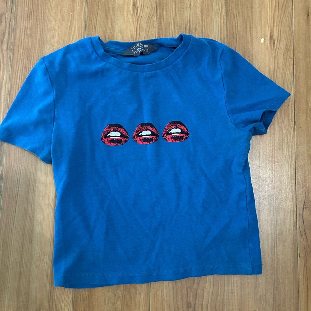 Primark Blue and Red Short Sleeve Tee with Graphic Design